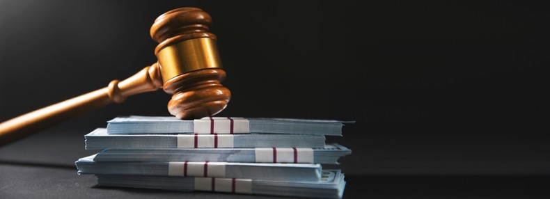 Gavel with Stacks of Banknotes
